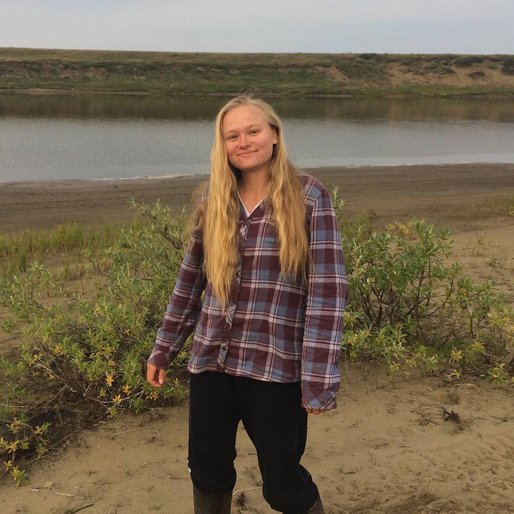 Nicole walks along the shoreline in Atqasuk.